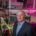 Image of a white, middle aged bald man in a science lab